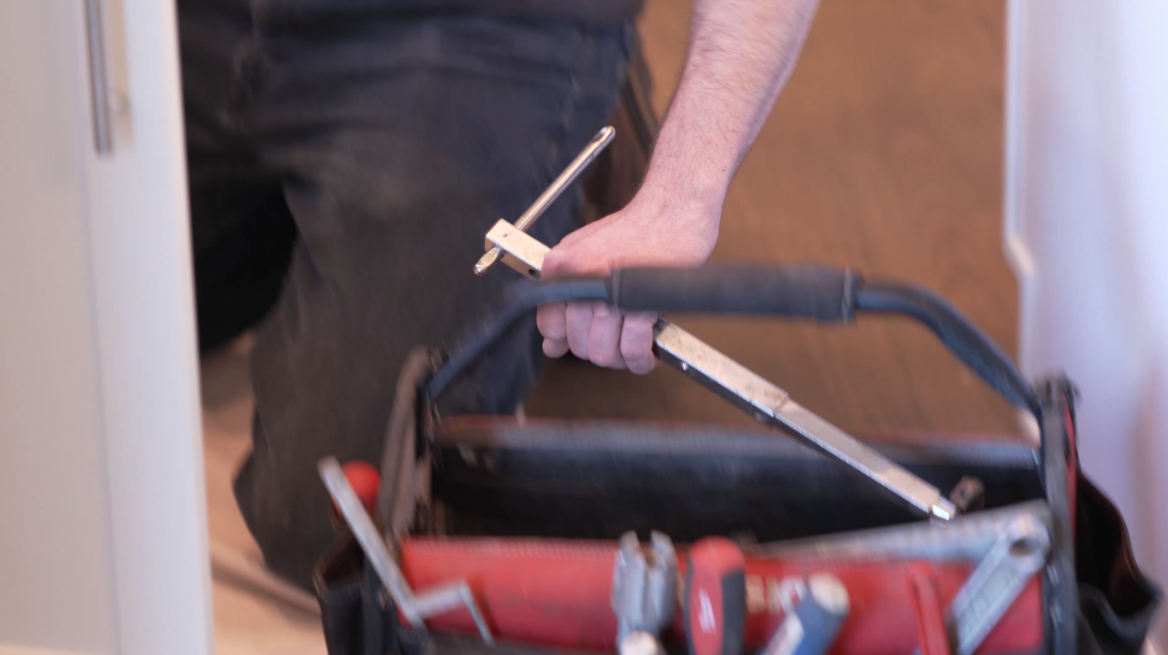Raptor Rooter & Plumbing technician preparing tools for backflow testing in Spokane Valley